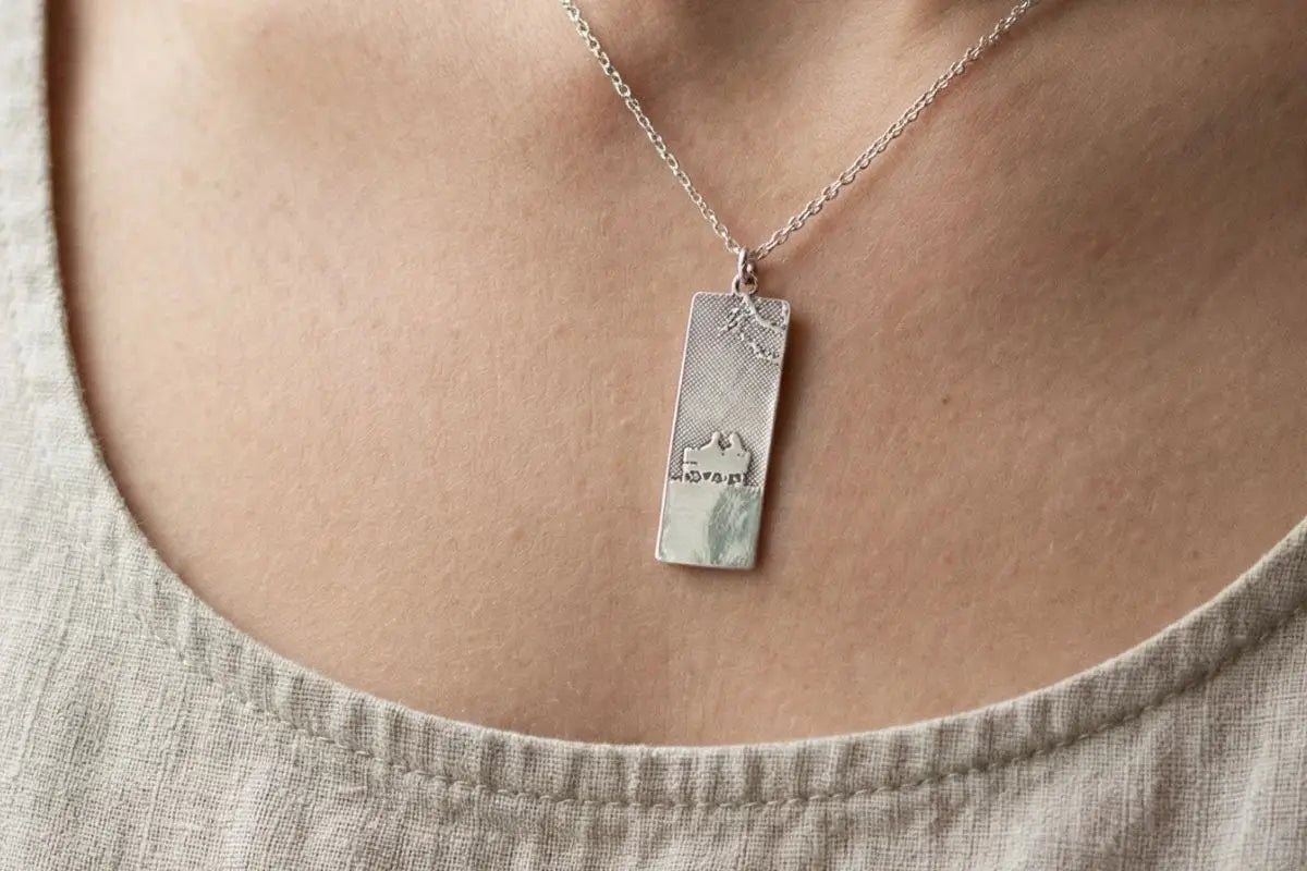Sentimental silhouette necklace capturing a meaningful family moment