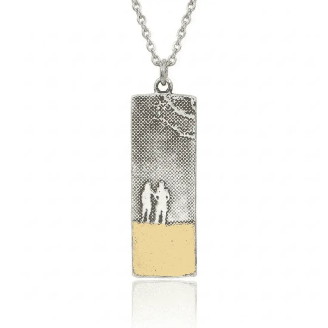 Beach memories soulmates necklace with etched silver silhouette of two women standing together on the beach, which is finished with 22ct gold vermeil.