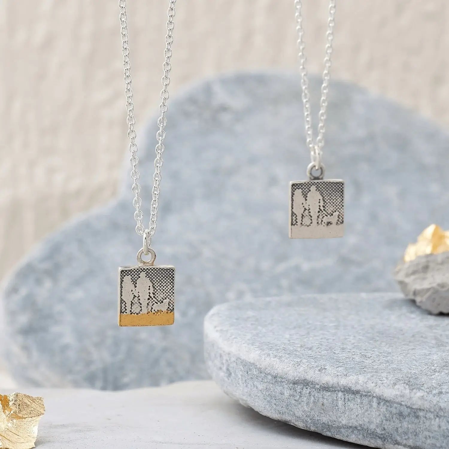 Small sterling silver couple and dog beach necklace shown in silver and golden beach detail finishes.