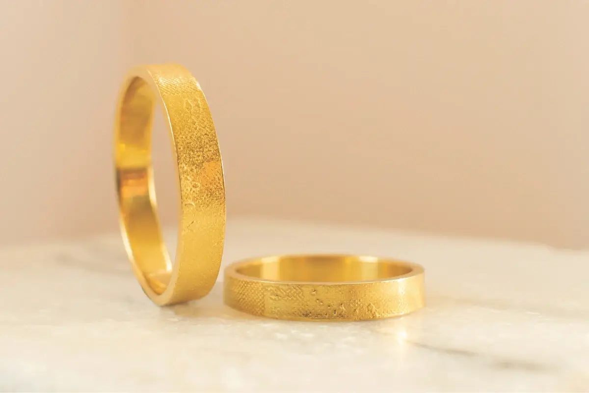 Handmade sentimental gold silhouette rings crafted using Charlotte Lowe’s signature technique, featured on the memory jewellery collection.