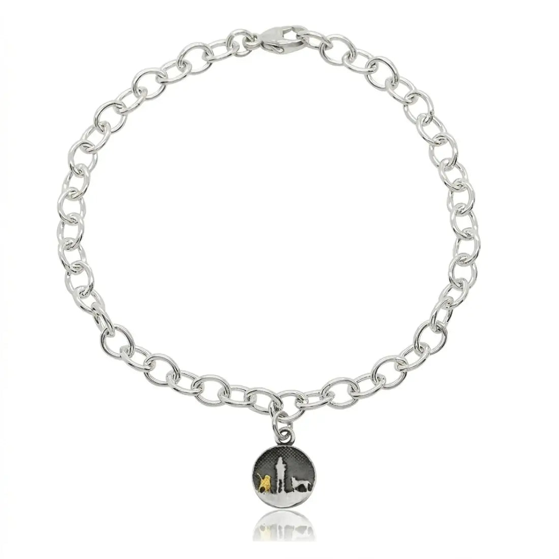 Sterling silver bracelet with a moonlit night sky charm showing an owner walking with two dogs, one highlighted in gold and one in silver.