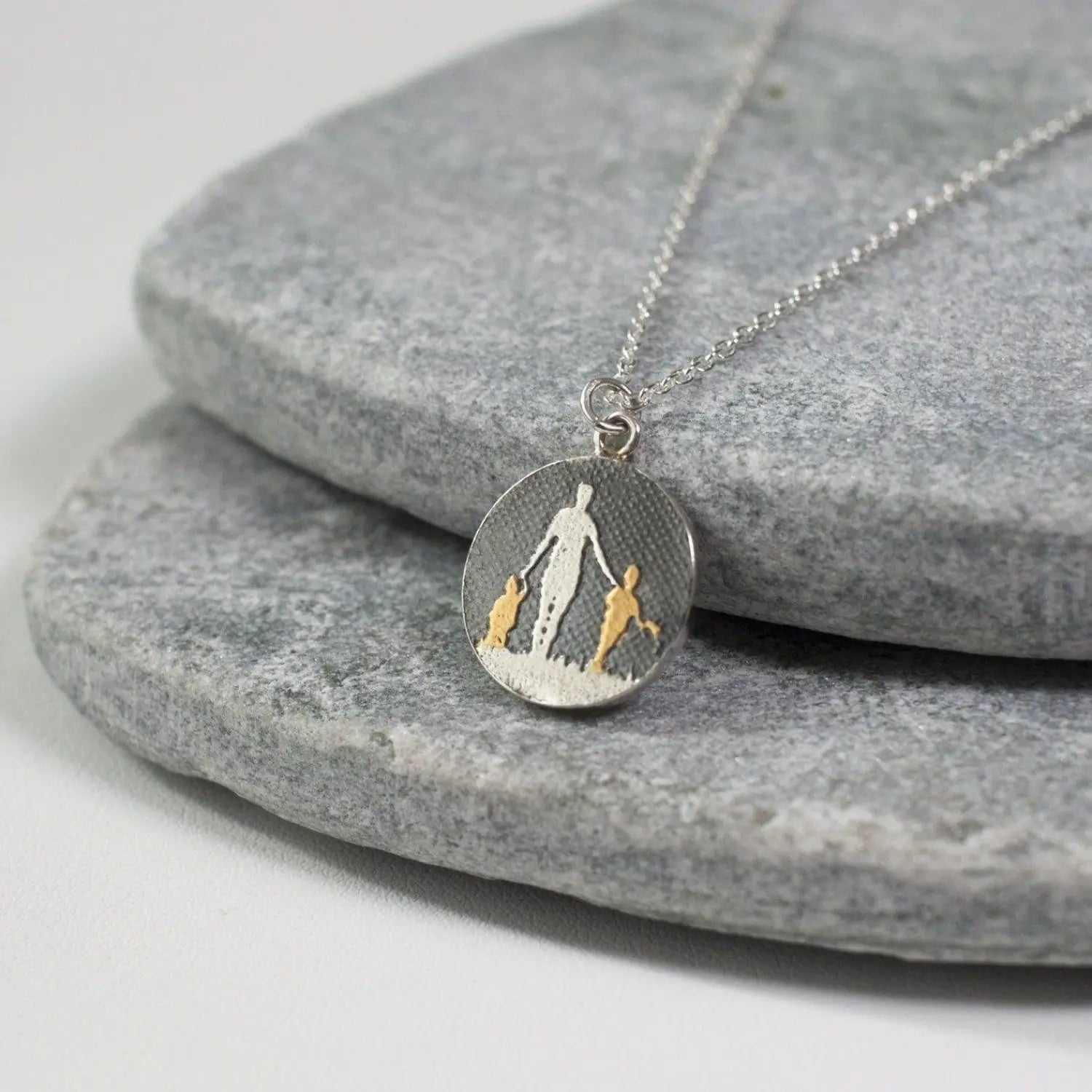 mother of two golden children necklace in black on gold finish with slate background sterling silver – mum