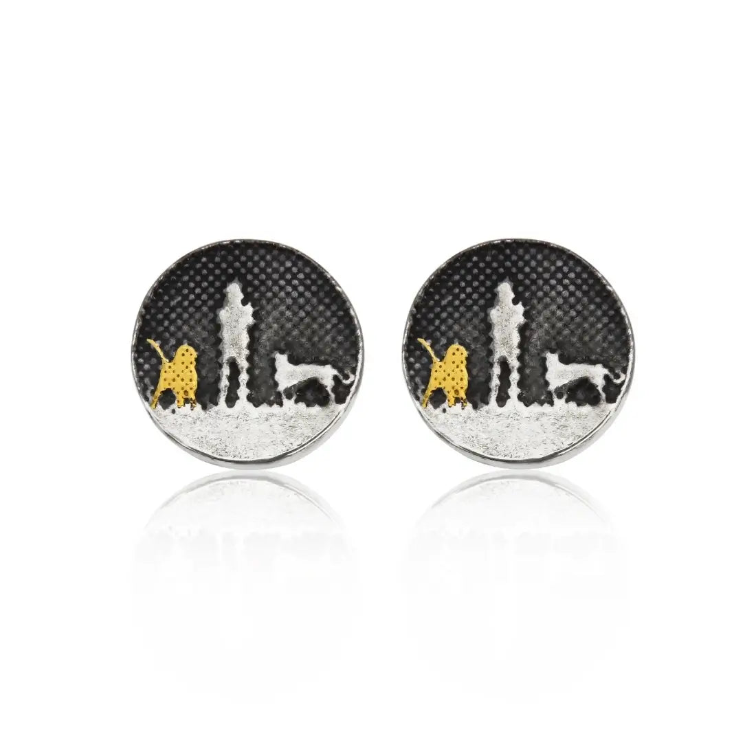 Night’s sky stud earrings showing an owner walking with one gold‑detail dog and one silver‑etched dog.