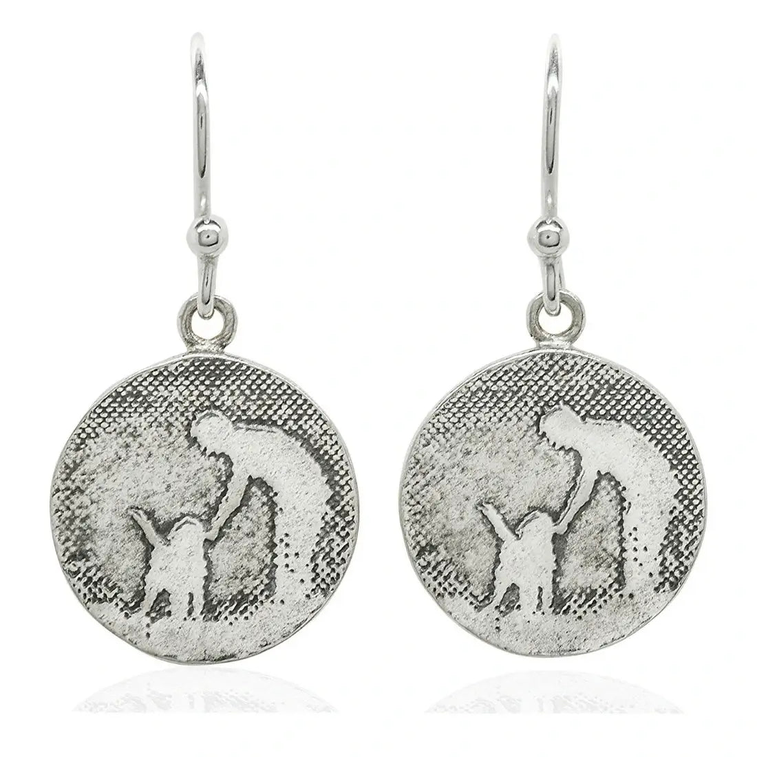 Large round sterling silver earrings etched with an owner leaning down to gently pet their dog.