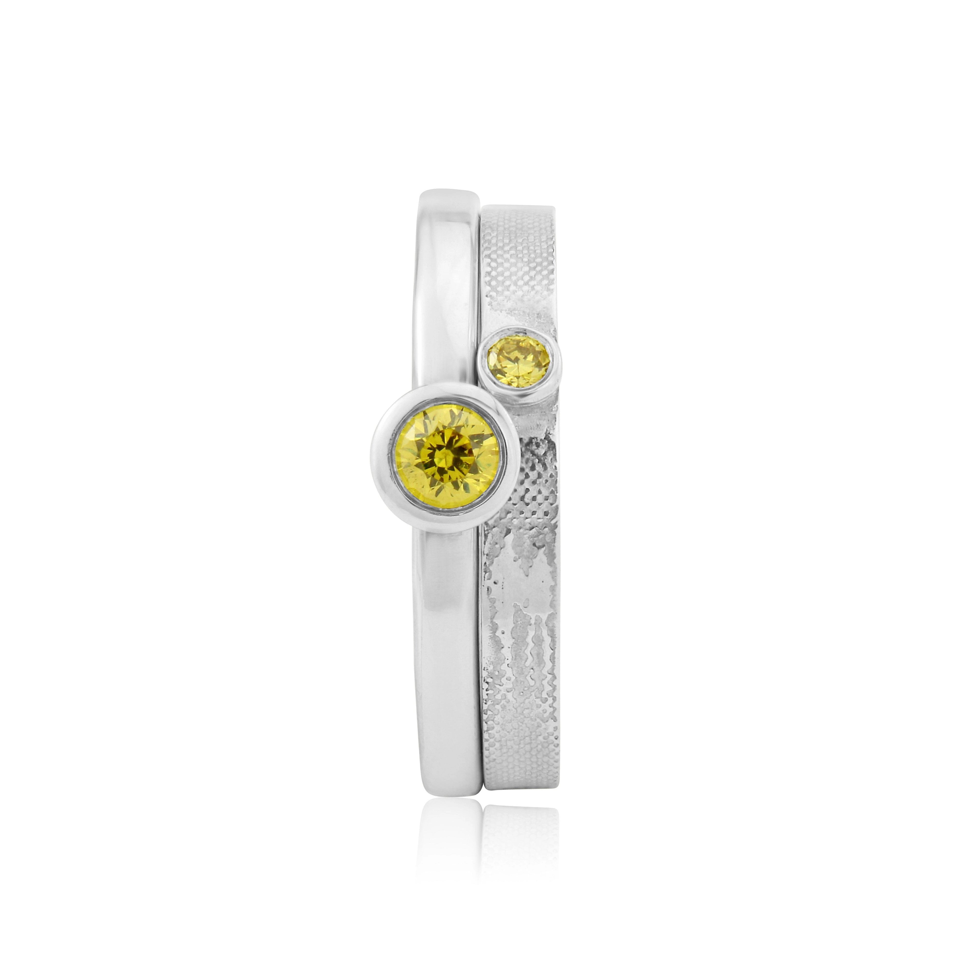 Sunset Chasers wedding band with silhouette and yellow diamond paired with matching yellow diamond engagement ring