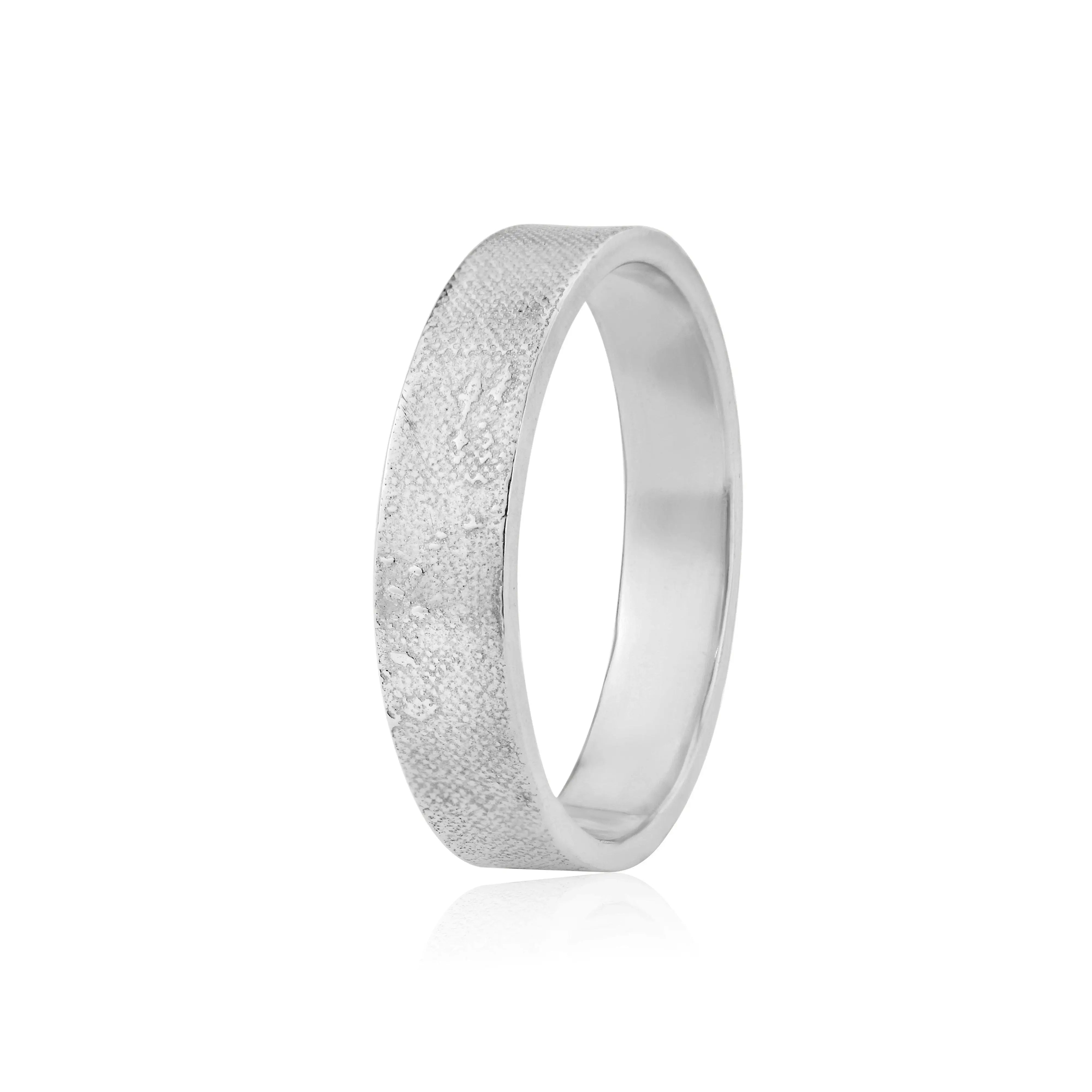 Unique gents wedding ring featuring couple walking along the sand etched into band