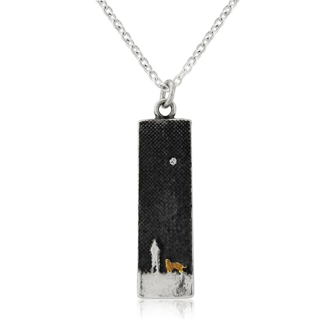 Small sterling silver dog necklace featuring an owner and dog under the moonlit sky with a gold‑vermeil dog and diamond star detail.