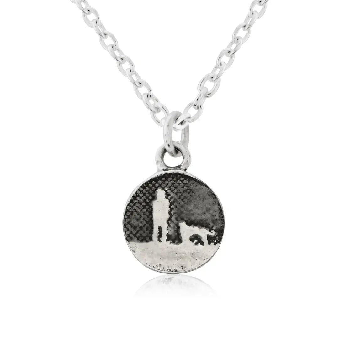 Walks Under Night’s Sky Silver Dog Charm displayed on a silver chain, showing a small round charm etched with an owner and their dog beneath an oxidised night sky, featuring a single silver dog.