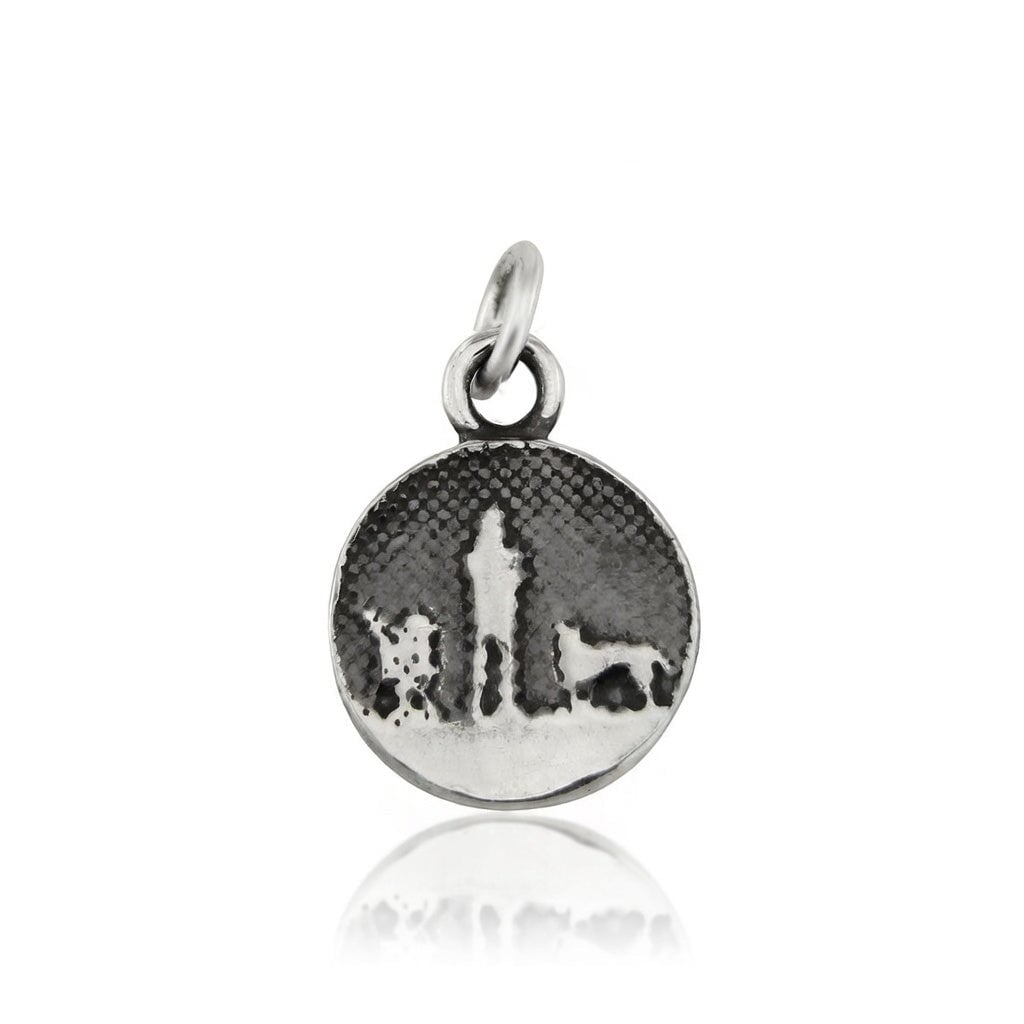 Walks Under Night’s Sky Silver Dog Charm showing a small sterling silver round charm etched with an owner and two dogs beneath an oxidised night sky, featuring two silver dogs.