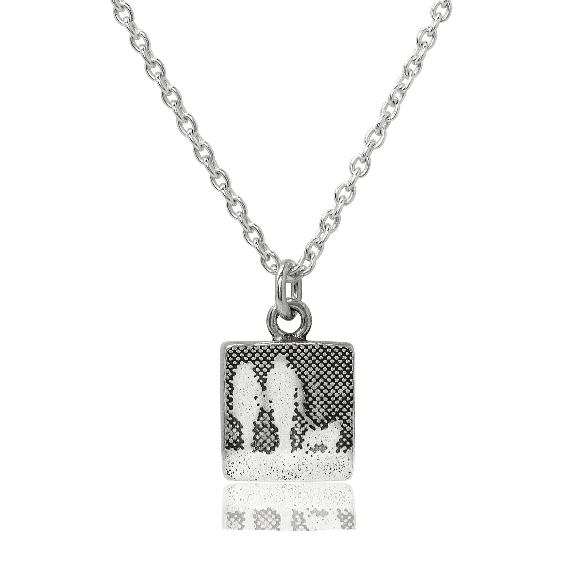 Small sterling silver couple and dog necklace showing two figures walking with their dog in silhouette.