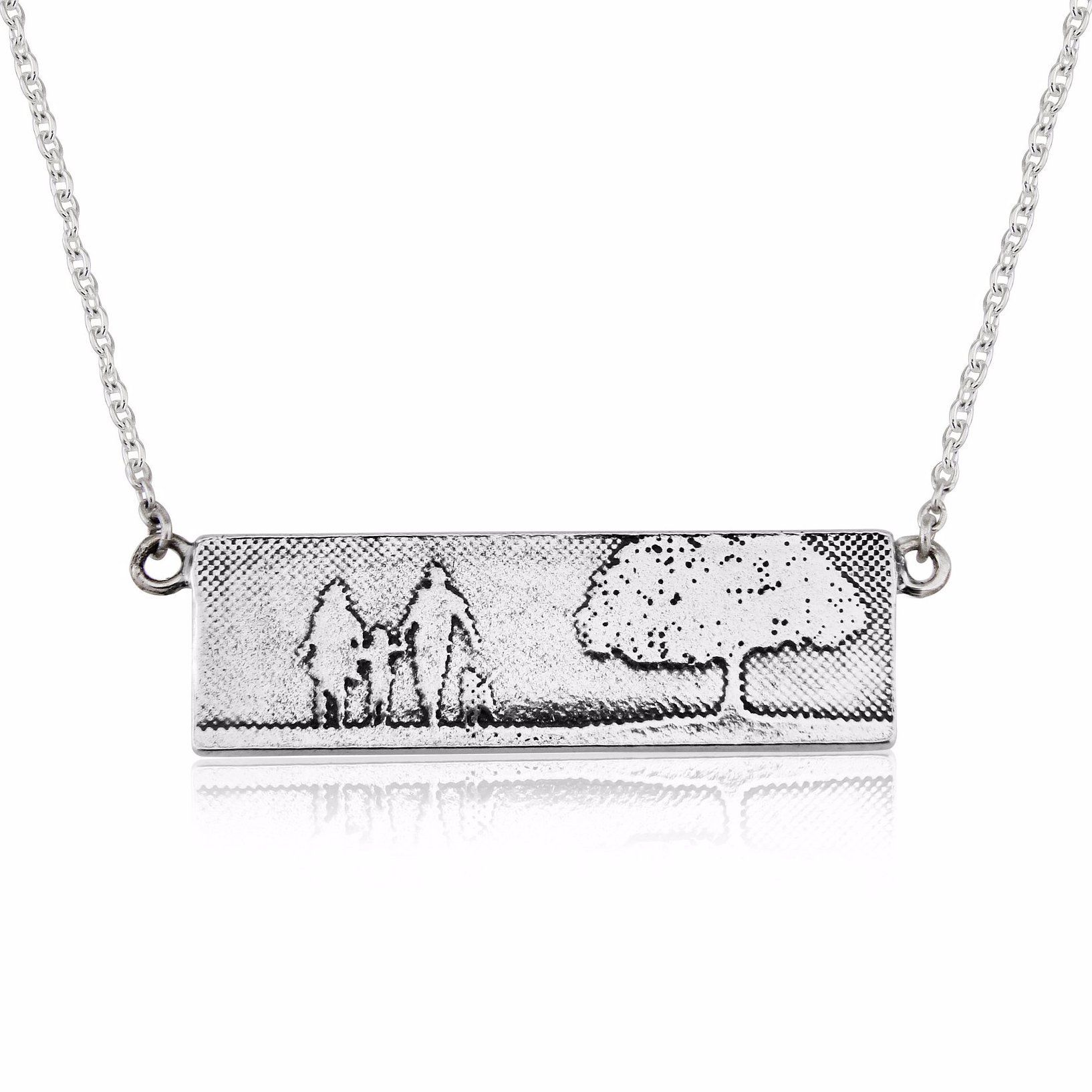 Sterling silver Dog Lovers Family Tree Necklace featuring an etched family of three with their dog beneath a detailed tree, shown in a rectangular landscape pendant with oxidised detail.
