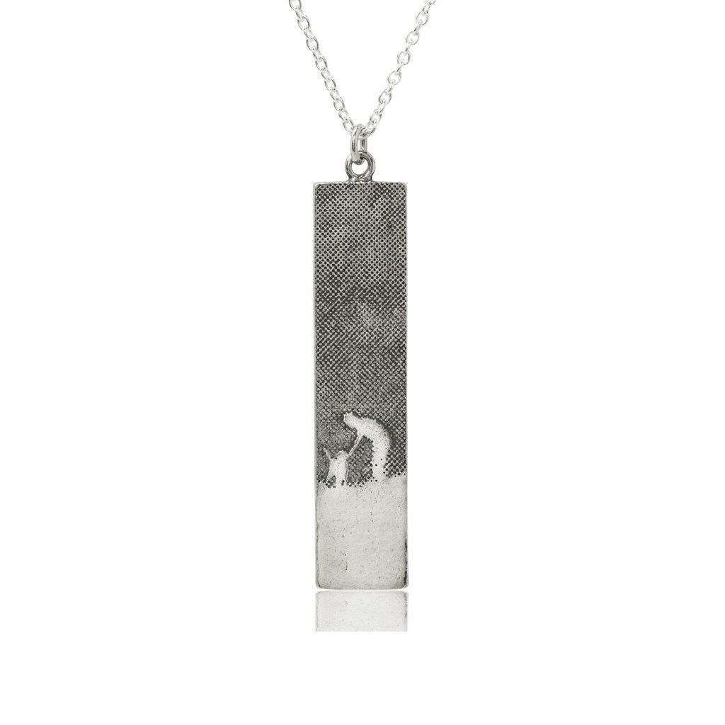 Large sterling silver dog lovers necklace with an etched owner and dog walking through the countryside, shown in a rectangular silhouette with oxidised detail.