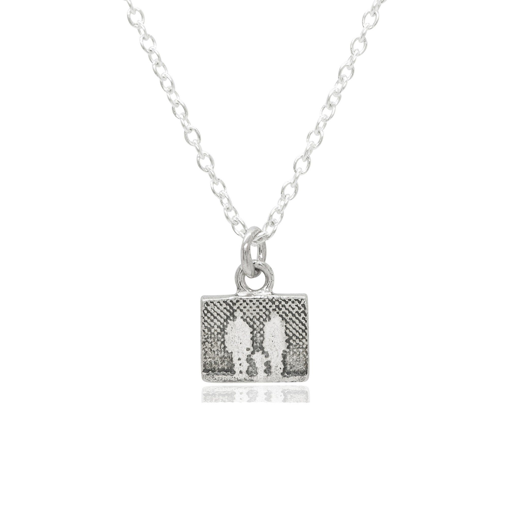Little Silver Family Necklace showing a family of three etched in sterling silver