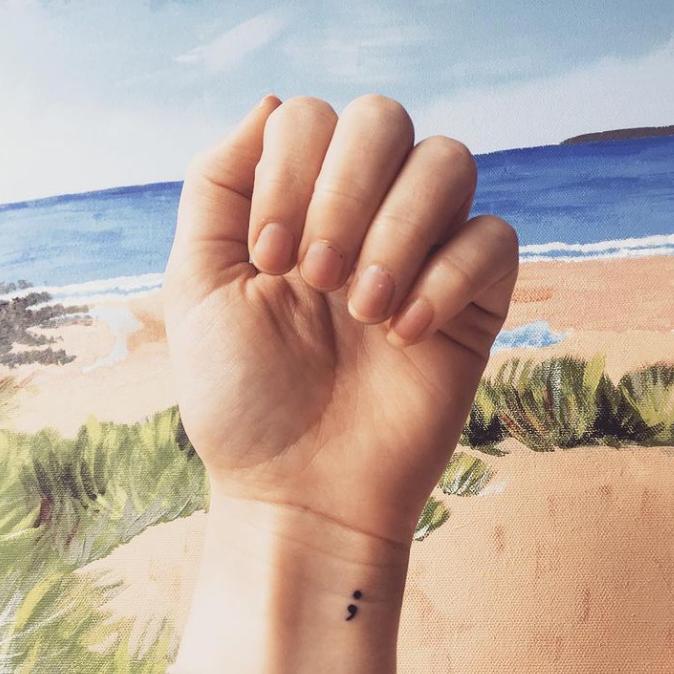Mental Health Awareness Engraving tattooed on wrist to demonstrate symbolism.