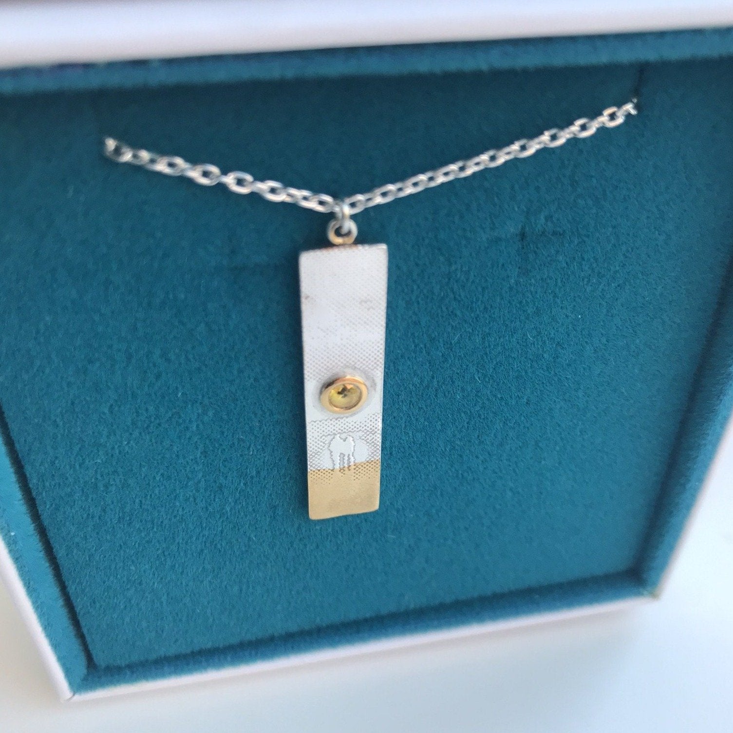 Sunset Necklace with Stunning Yellow Sapphire Sunshine in blue and white box.