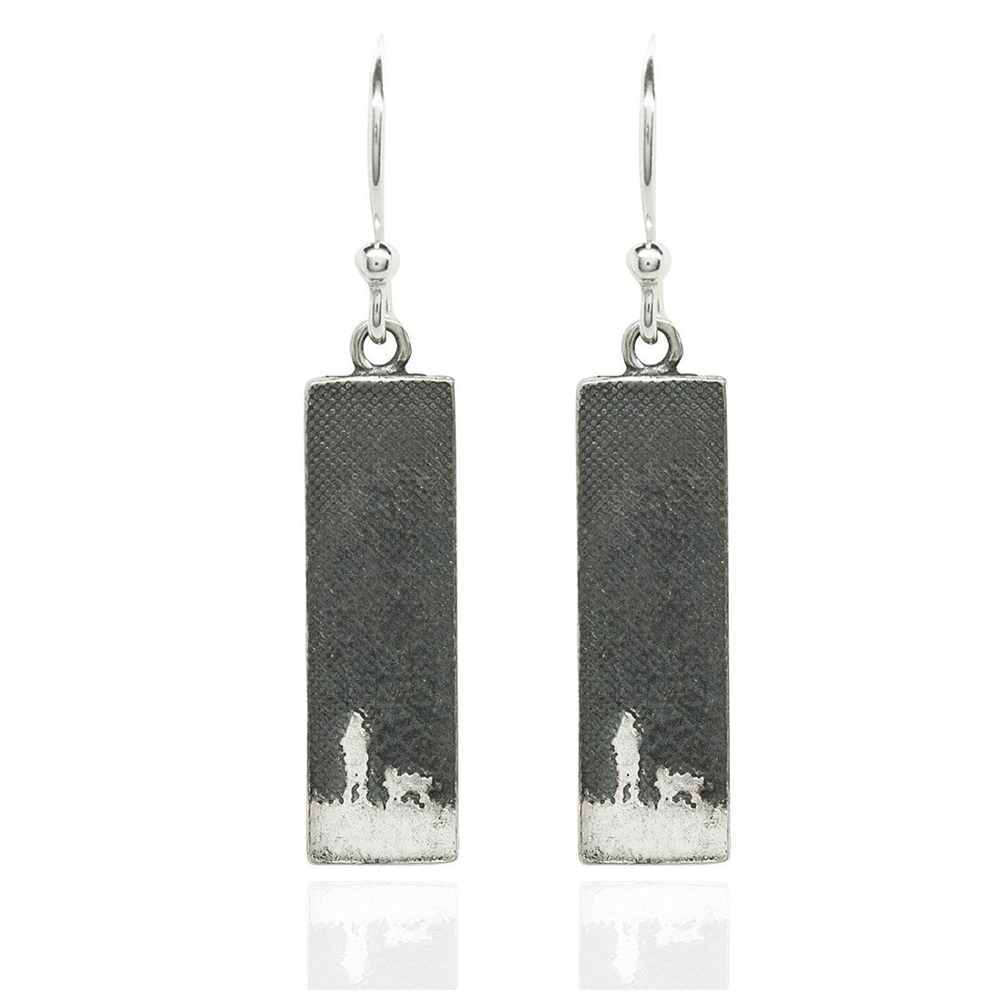 Sterling silver drop earrings etched with a dog lover walking under the moonlit sky.