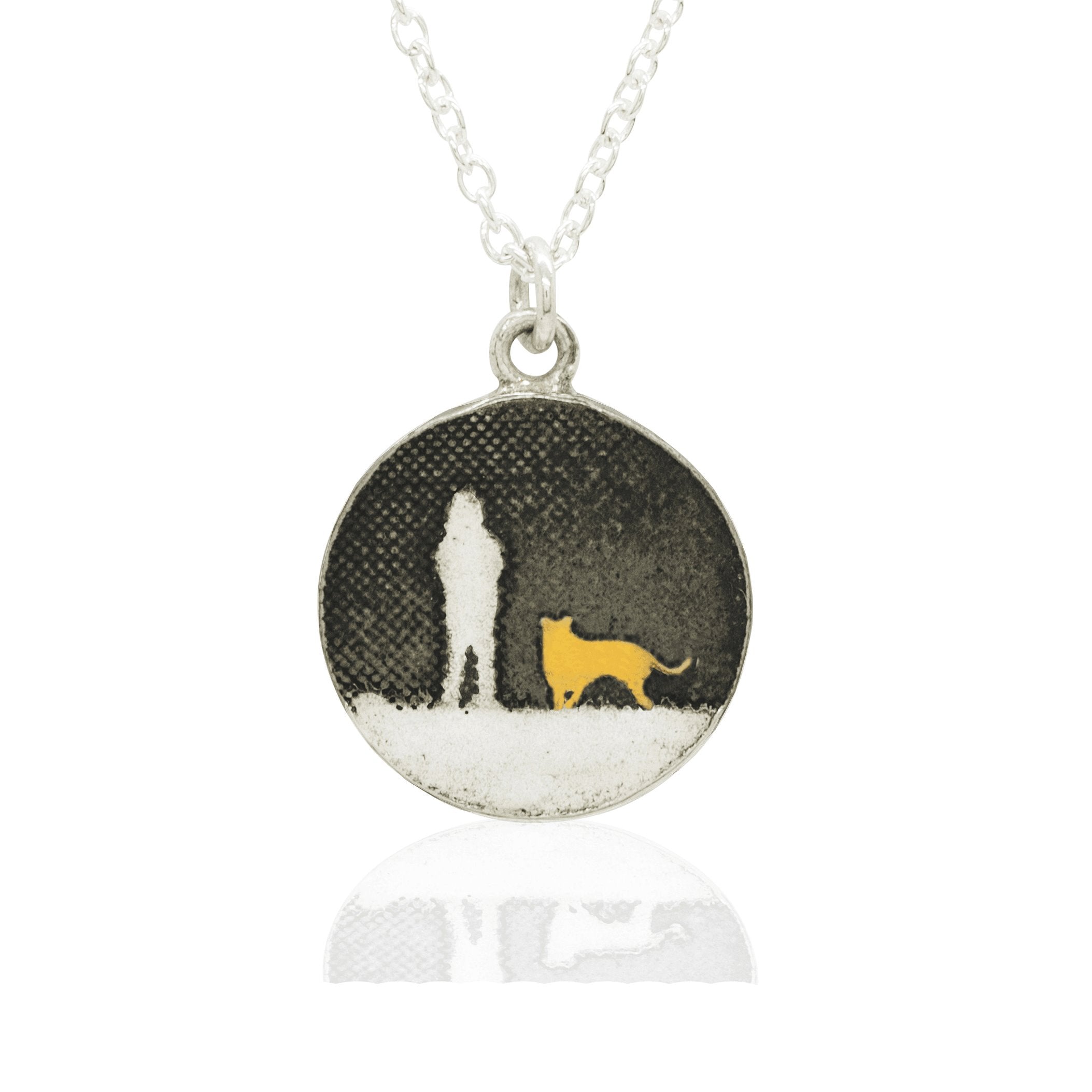 Detail of the gold‑vermeil dog on the sterling silver Walks Under the Moonlit Sky round necklace.