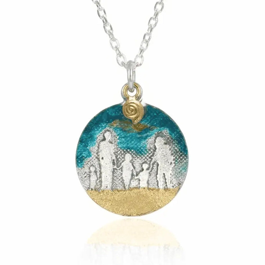 Blue Skies Beach Family Necklace showing etched family silhouettes with blue enamel sky and golden shell charm