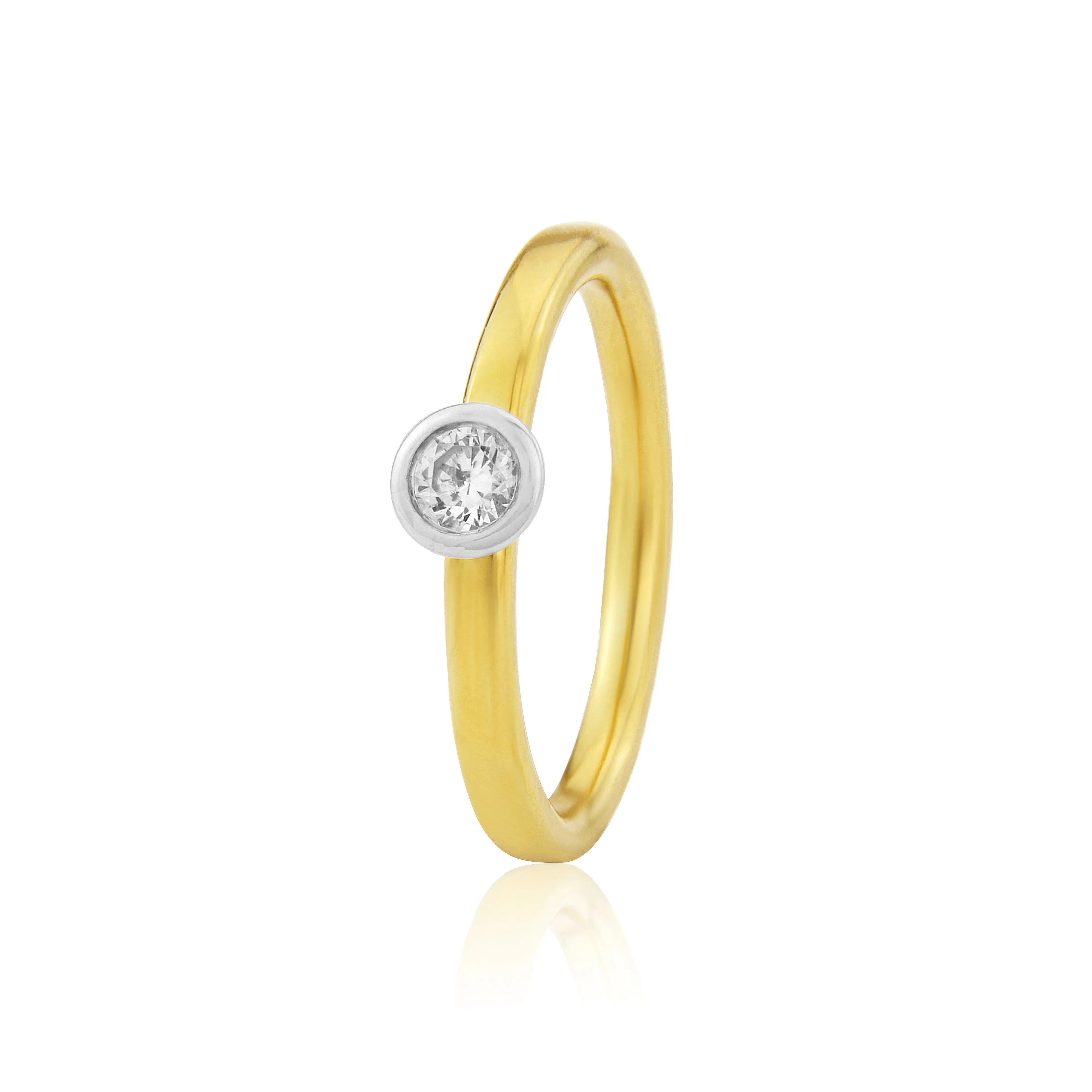 Contemporary yellow and white gold engagement ring with 0.17ct diamond in rub‑over halo setting