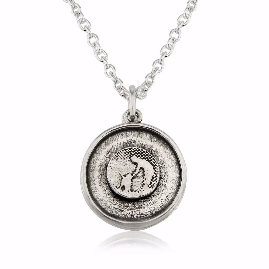 Sterling silver dog lovers locket with petting silhouette and a silver sky finish, shown closed with etched detail.