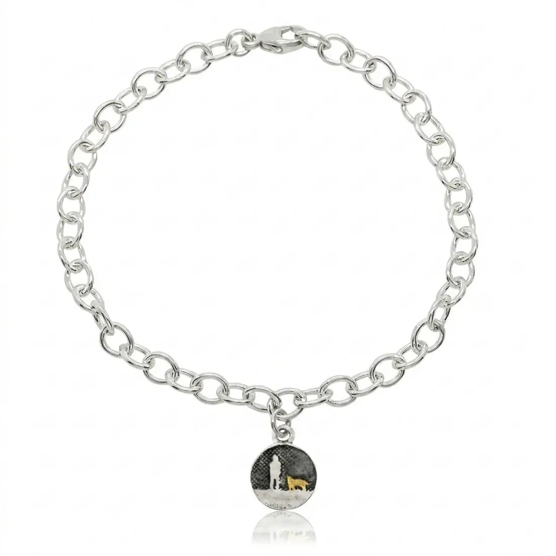 Sterling silver bracelet with a moonlit night sky charm showing an owner walking with two dogs, one highlighted in gold.
