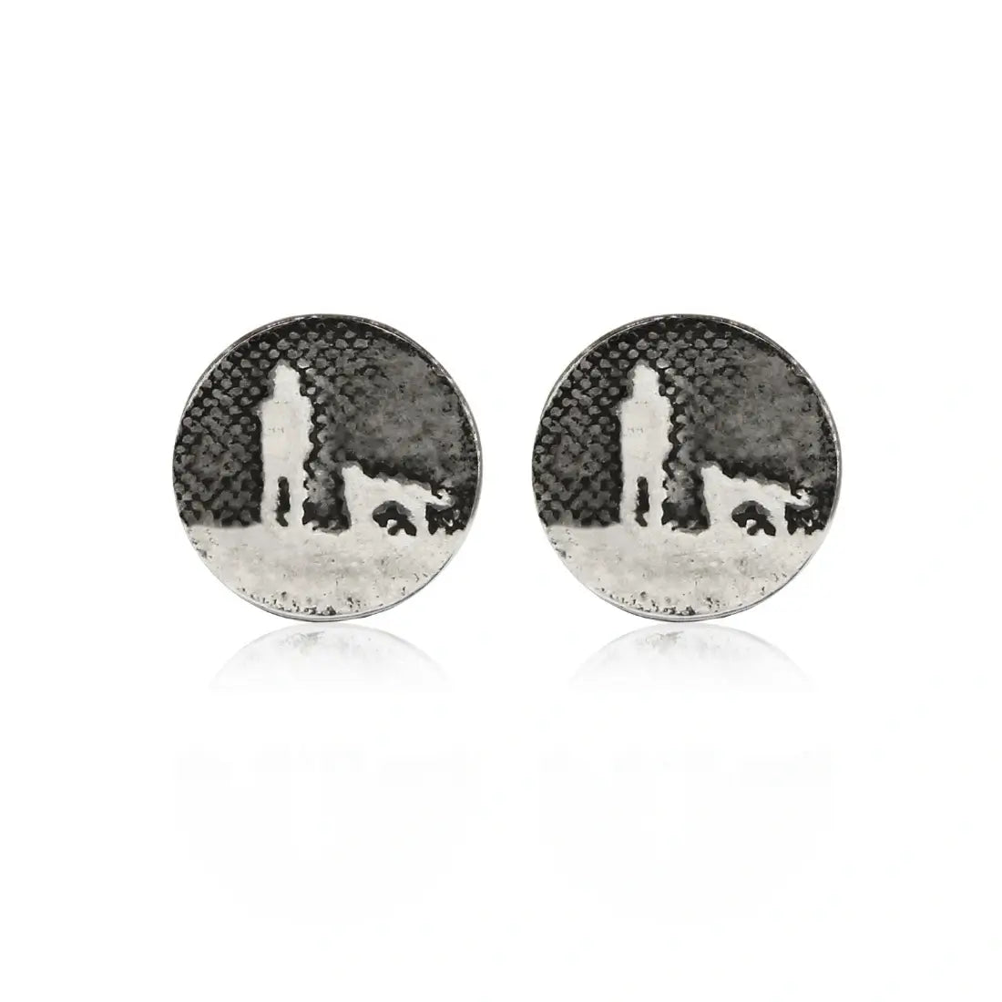 Silver dog stud earrings etched with an owner and their dog walking under the night sky.