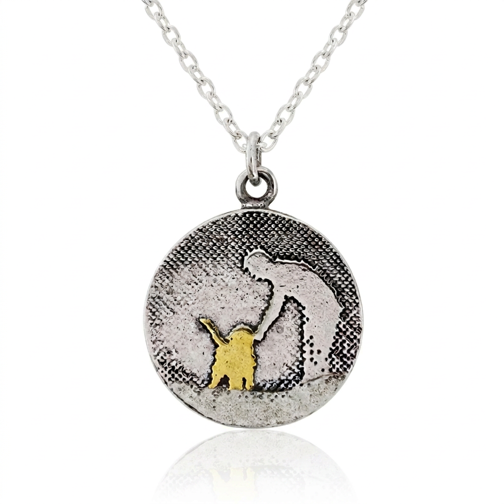 Round sterling silver dog lovers necklace featuring an etched petting silhouette with a 22ct gold vermeil dog and oxidised detail.