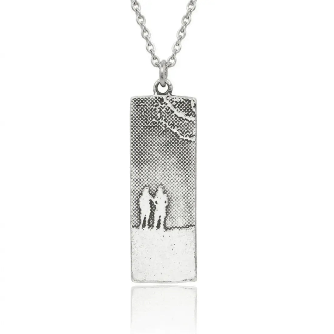 Soulmates necklace depicting two women etched into sterling silver.