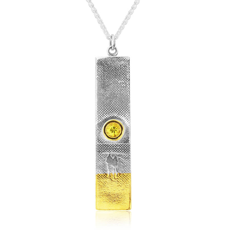 Sunset couple necklace with stunning yellow sapphire in the centre.