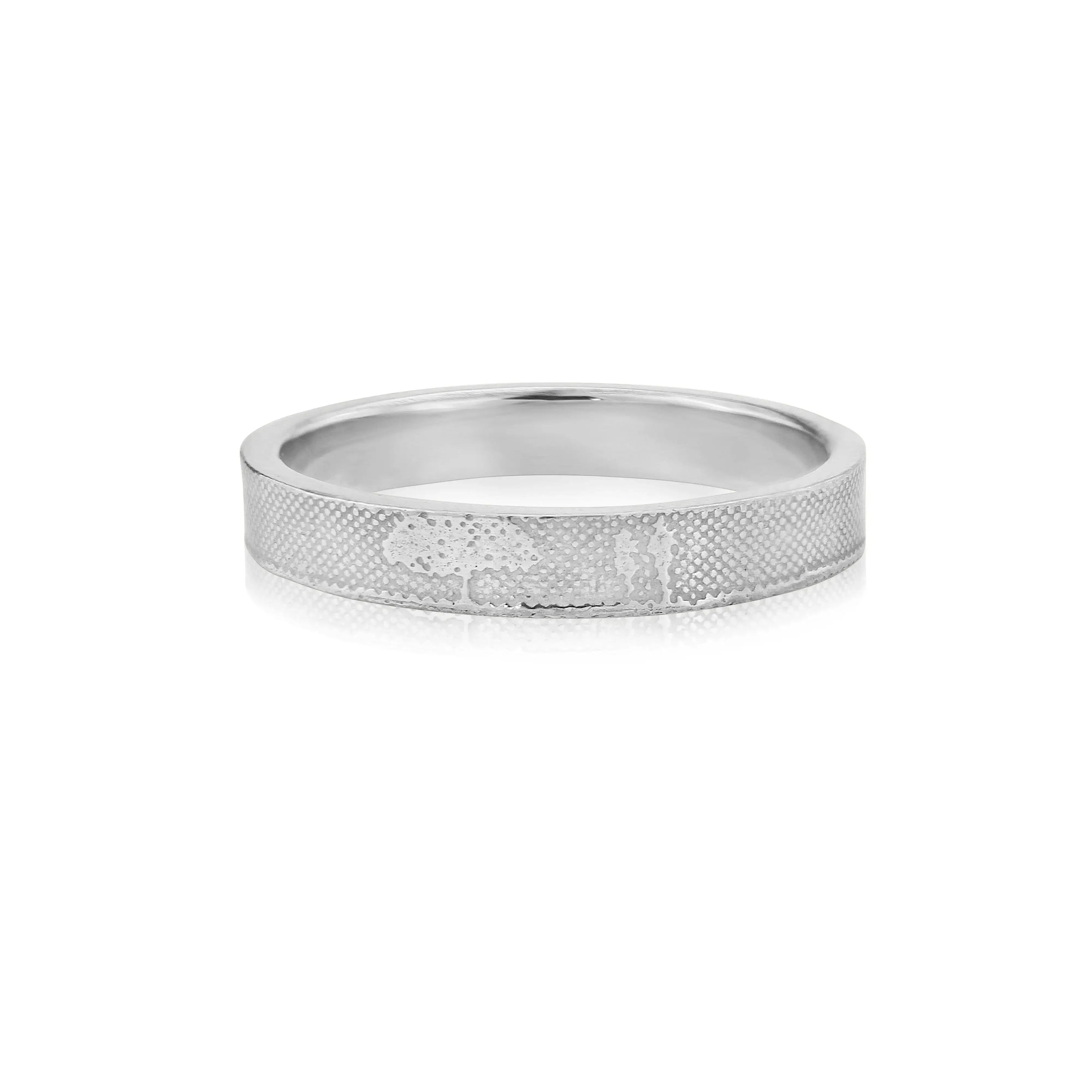 Unique white gold wedding ring detail with countryside couple silhouette by Charlotte Lowe.