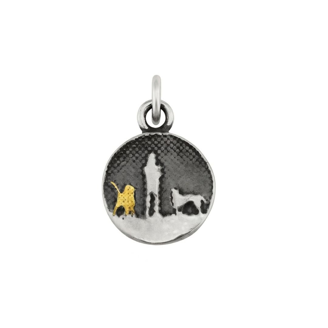 Walks Under Night’s Sky Dog Charm showing a small sterling silver round charm etched with an owner and two dogs beneath an oxidised night sky, featuring one silver dog and one 22ct gold vermeil dog.