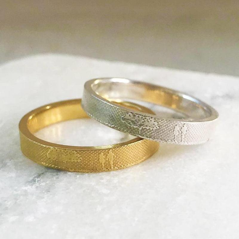 Unique wedding rings featuring countryside couples in gold and platinum
