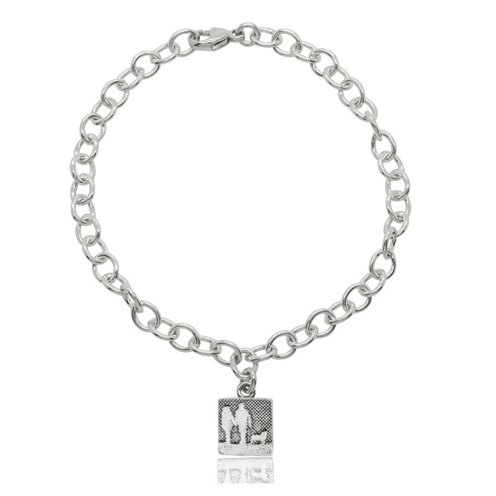 Sterling silver bracelet with a square charm etched with a couple walking their dog in silhouette.