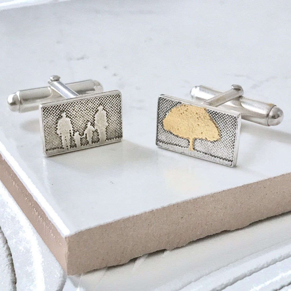 Dad cufflinks featuring gold‑vermeil tree detail.