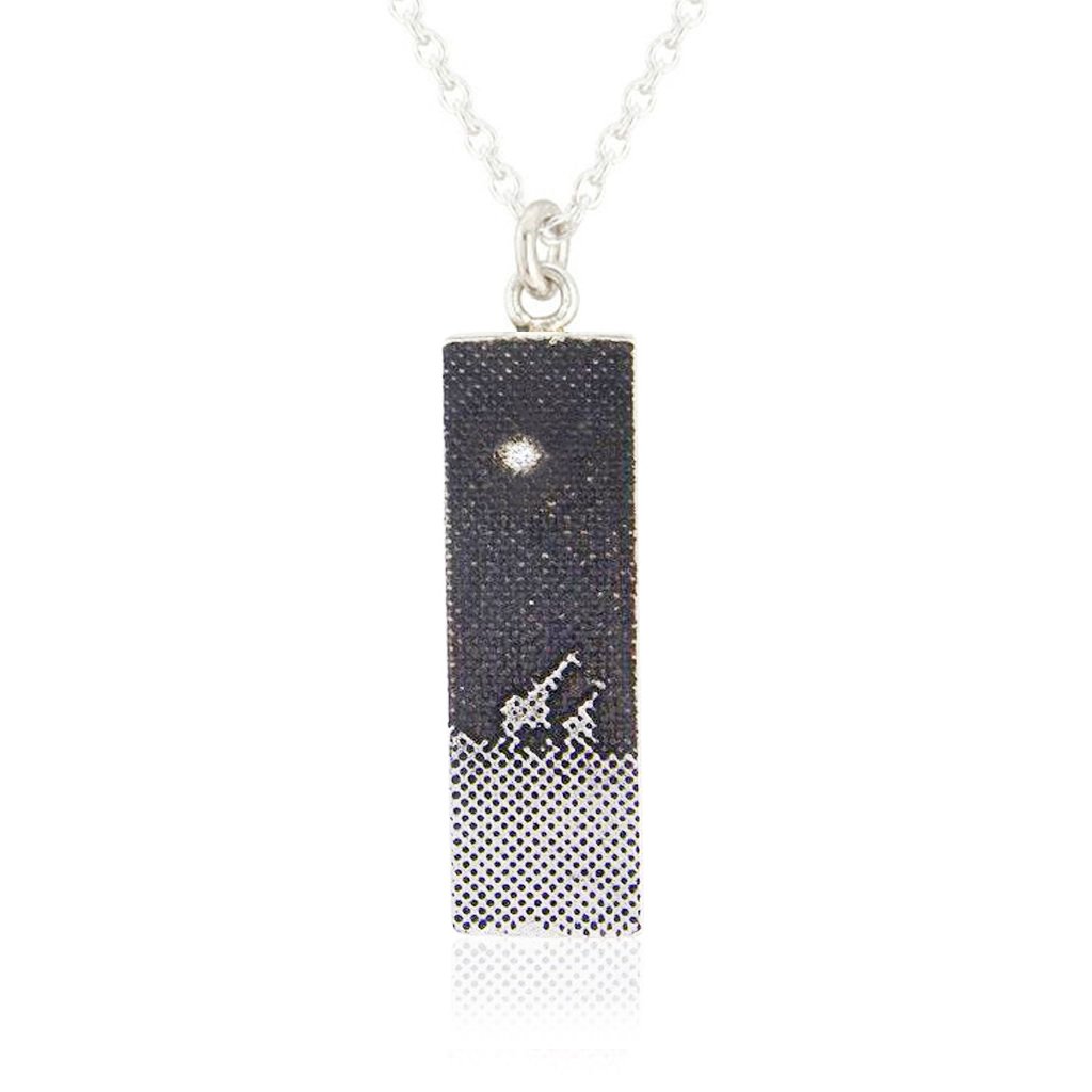 Giraffe Under the Night Sky Necklace with two silver giraffes walking across an oxidised silver sky beneath a 1.1mm diamond star.