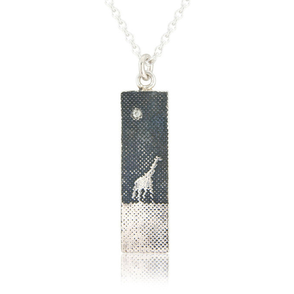 Giraffe Under the Night Sky Necklace with one silver giraffe walking across an oxidised silver sky beneath a 1.1mm diamond star.