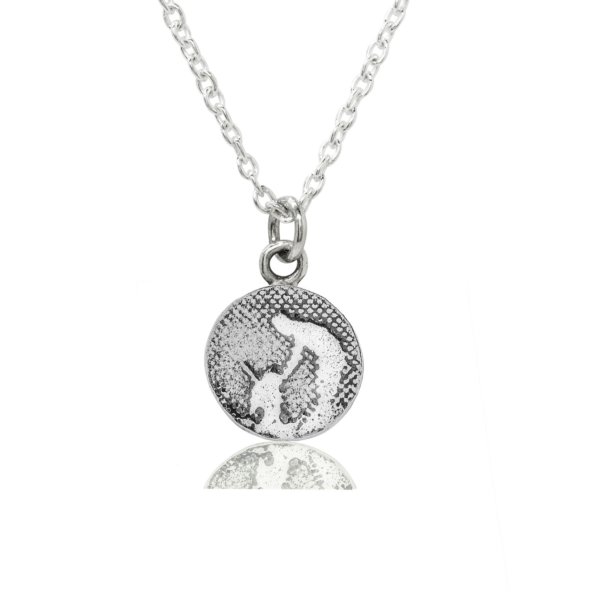 Round Silver Dog Charm displayed on a silver chain, showing a small sterling silver round charm etched with an owner and their dog, symbolising treasured moments shared with man’s best friend.