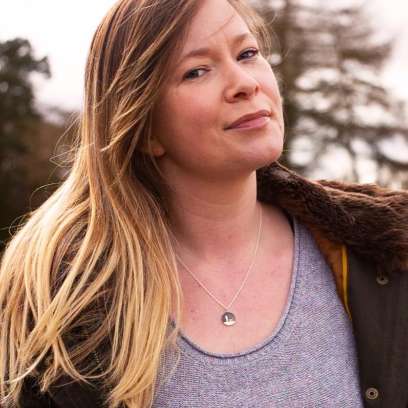 Model wearing the Round Walks Under Night’s Sky Gold Dog Necklace showing the sterling silver and gold‑vermeil silhouette pendant.