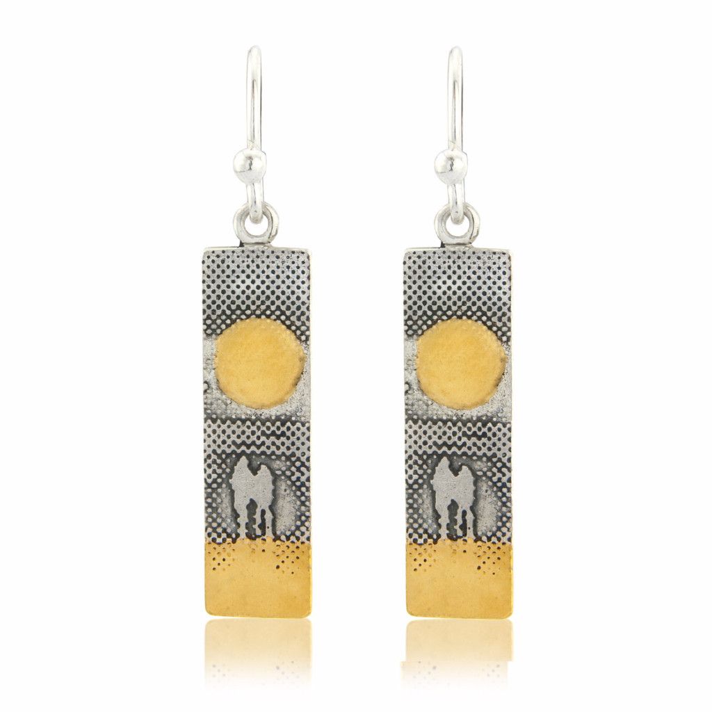 Sunset Couple Earrings showing two figures walking hand in hand beneath a golden sunset, with gold‑vermeil sun and sand.