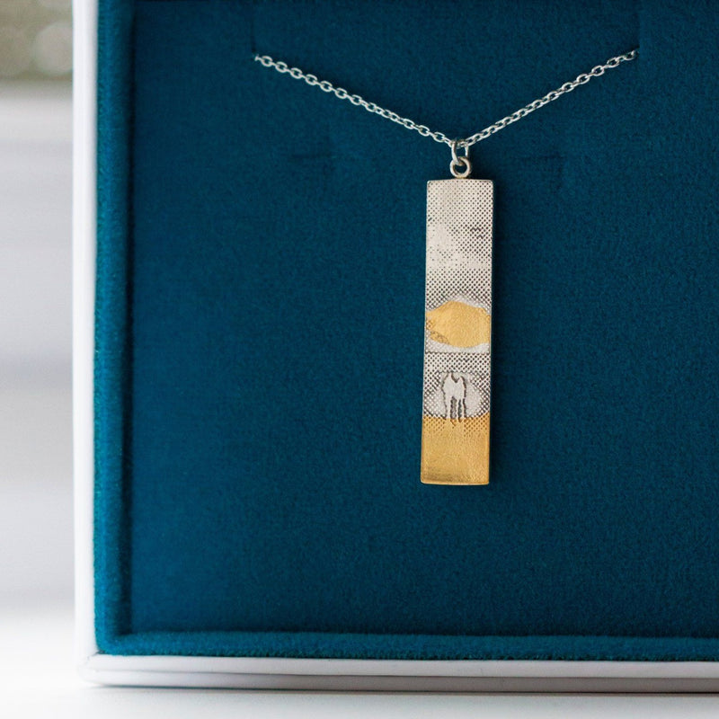 Sunset Couple Memory Necklace in Sterling Silver with 22ct gold vermeil details to highlight the sun and sand