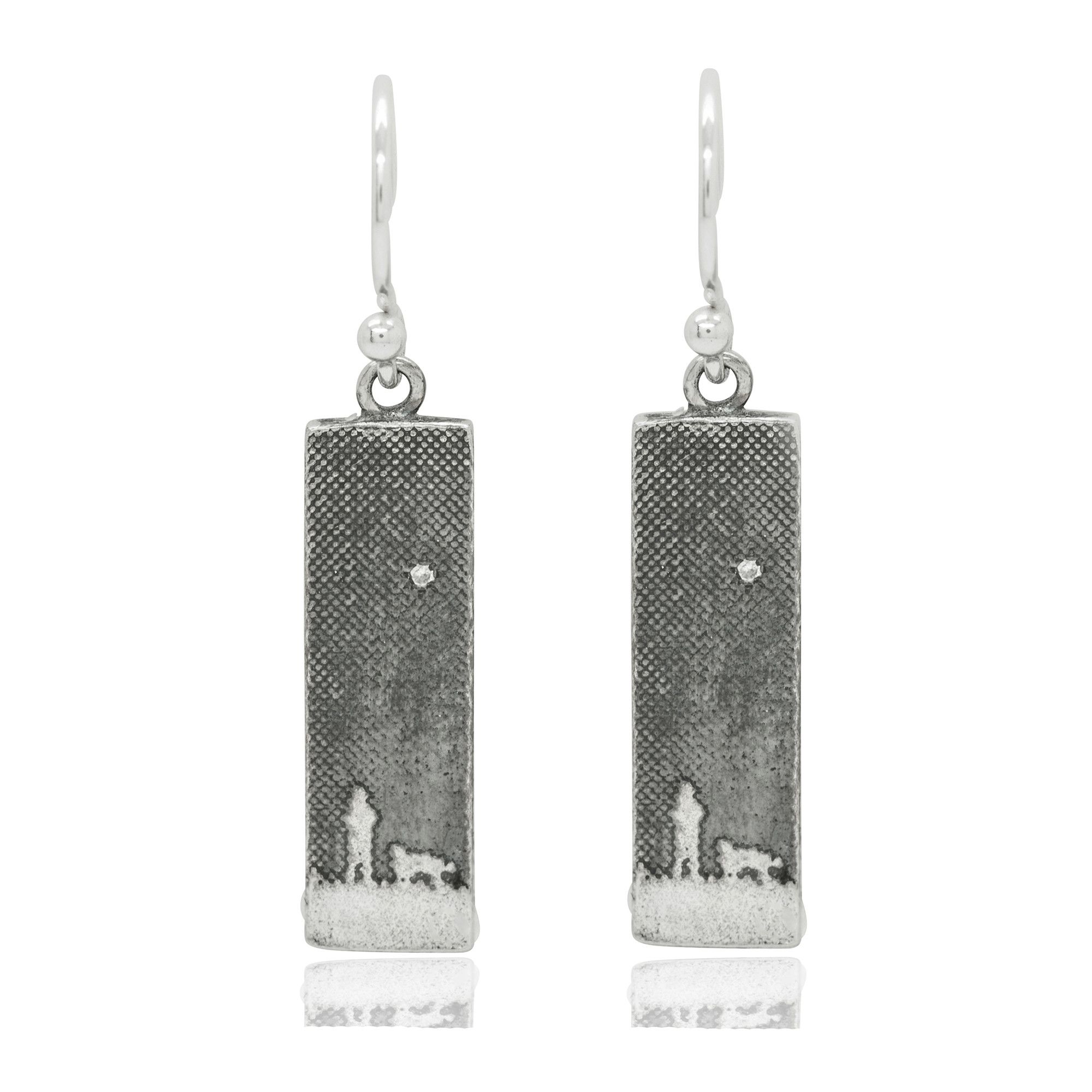 Silver drop earrings etched with a dog lover walking under the moonlit sky, finished with a diamond star.